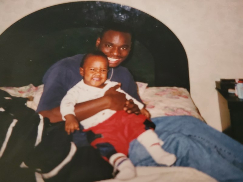 Gerald Berry, 16 in this photo, holding his baby brother Kendrick. Berry is serving life in prison on a felony murder conviction.